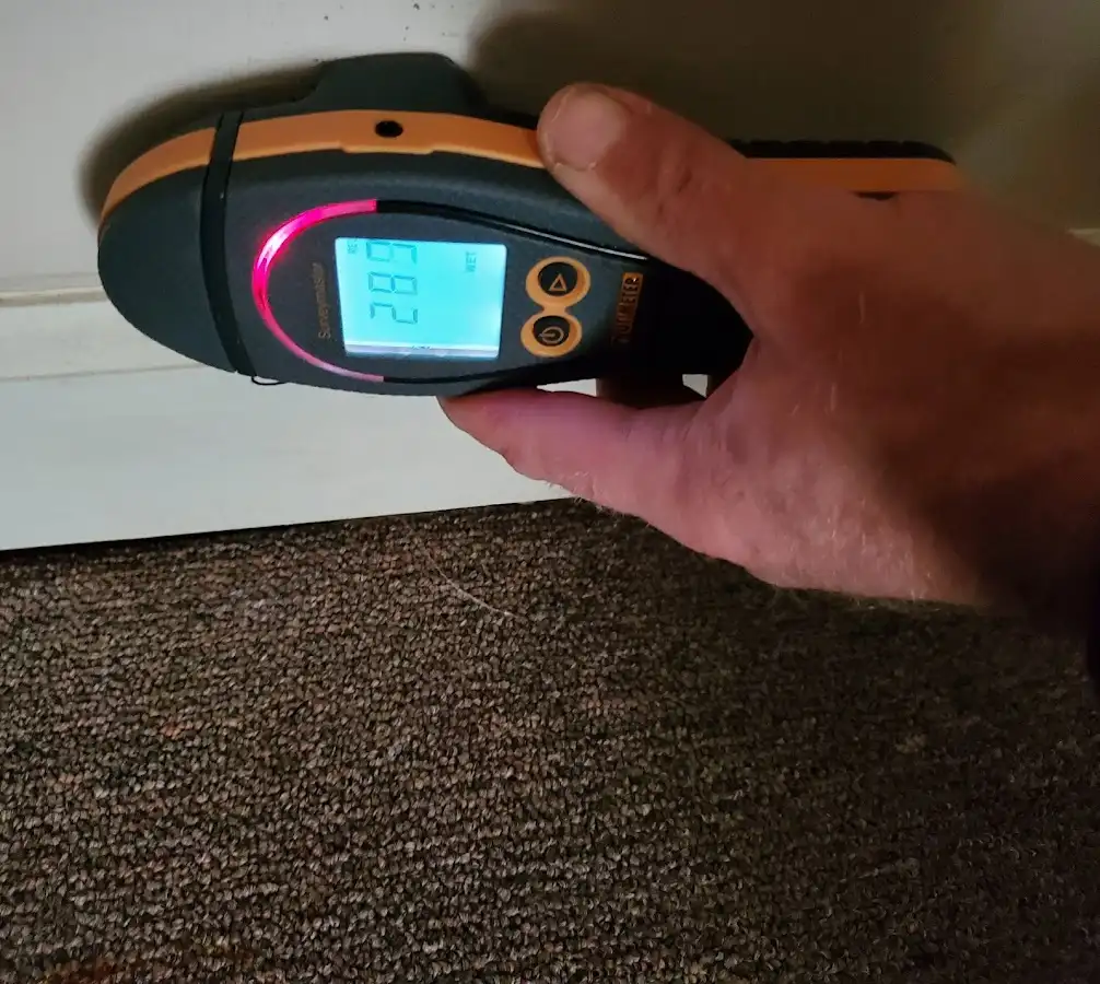 Moisture detection at baseboard during Sewage Cleanup & Sanitation in West Palm Beach